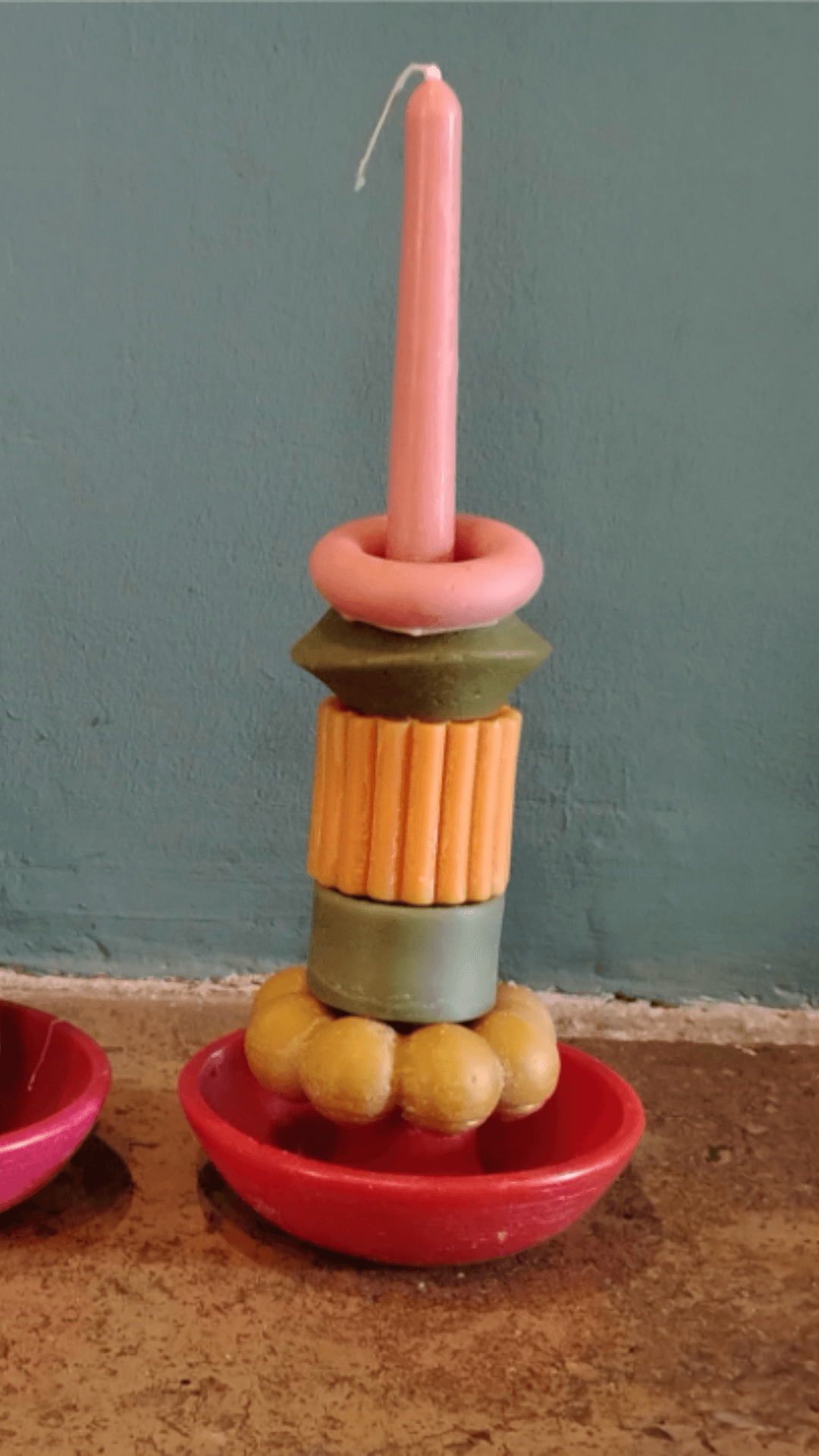 Candle with fluted orange piece and yellow balls