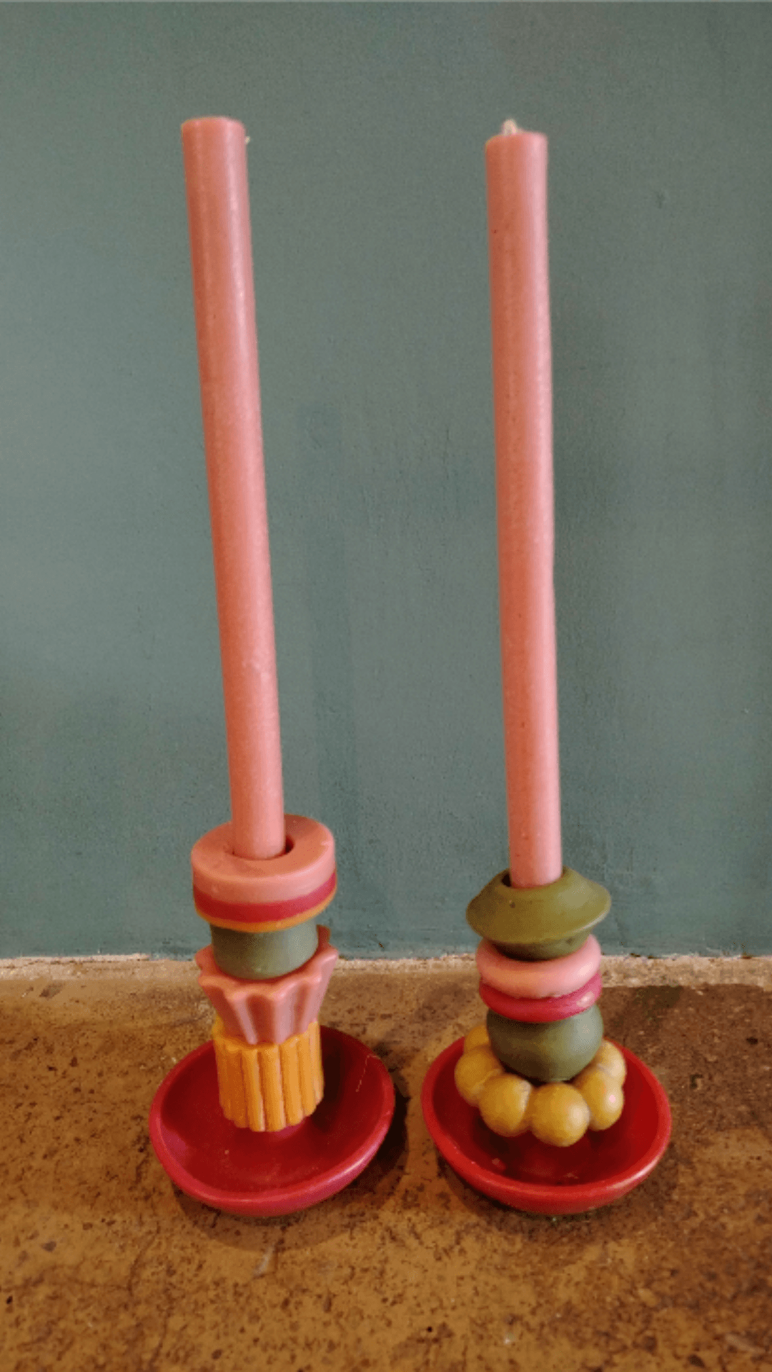 Matching pink candle pair with different stackable pieces