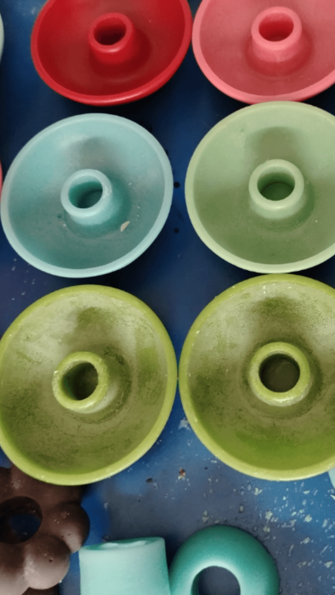 Wax candle holders in various colors